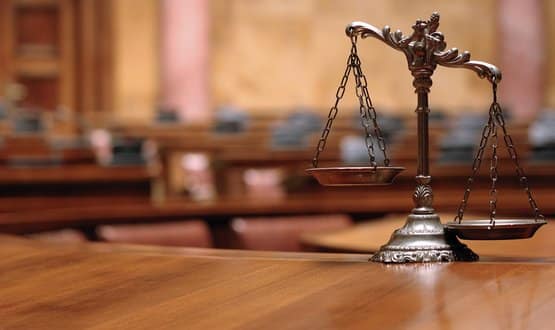 A set of weighing scales in an empty courthouse